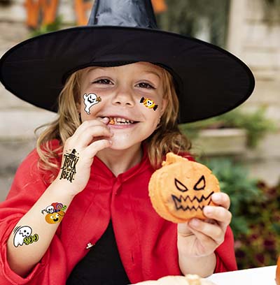 Little Girl Dressed Up As A Witch
